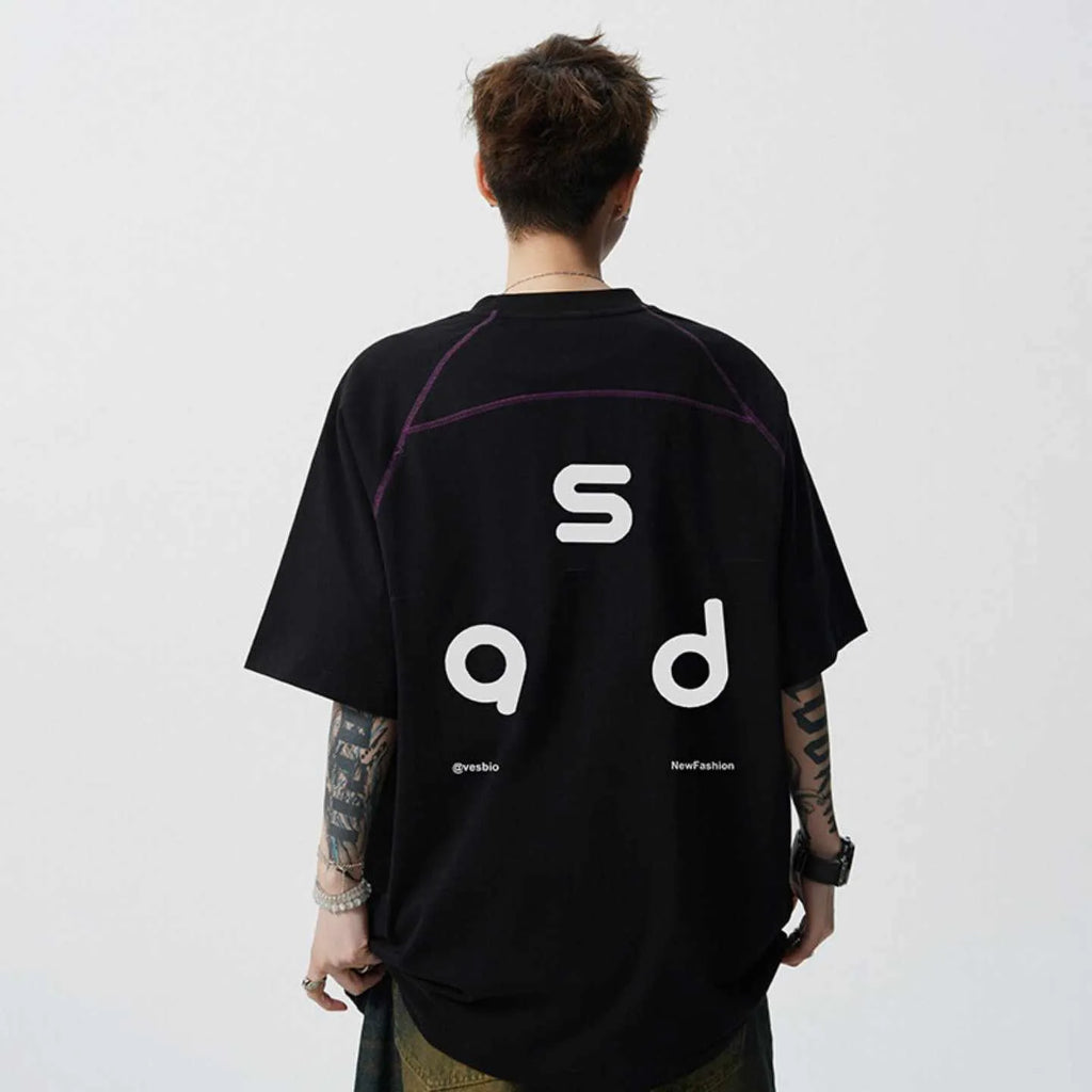 Black loose fit cotton T-shirt with short sleeves and a round neck collar featuring a letter print