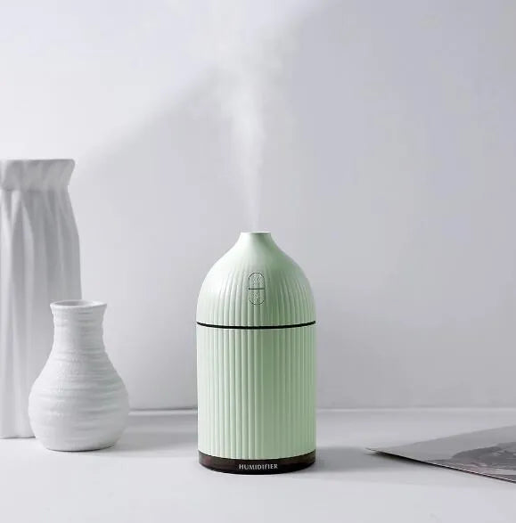 White ultrasonic aromatherapy diffuser with LED light and 300ml water capacity, measuring 80x80x155mm