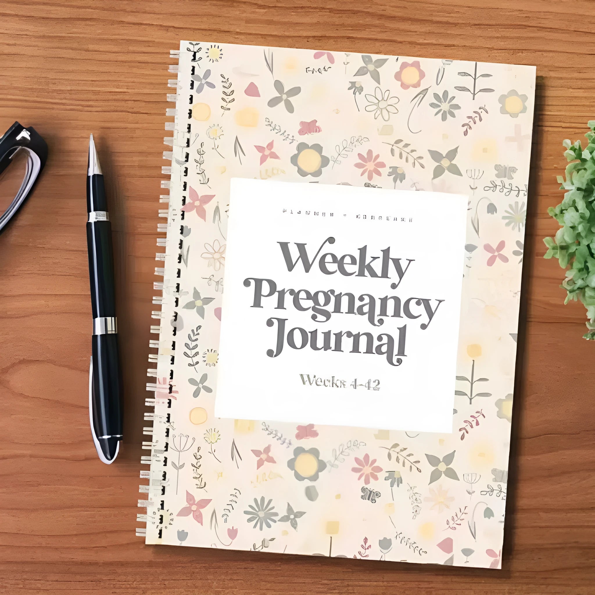 A5 pregnancy weekly diary notebook open showing weekly format pages