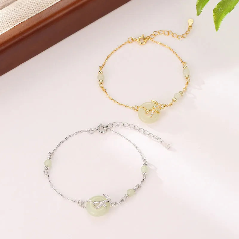 Women's antique-style silver bracelet with a safety buckle and peace buckle design.