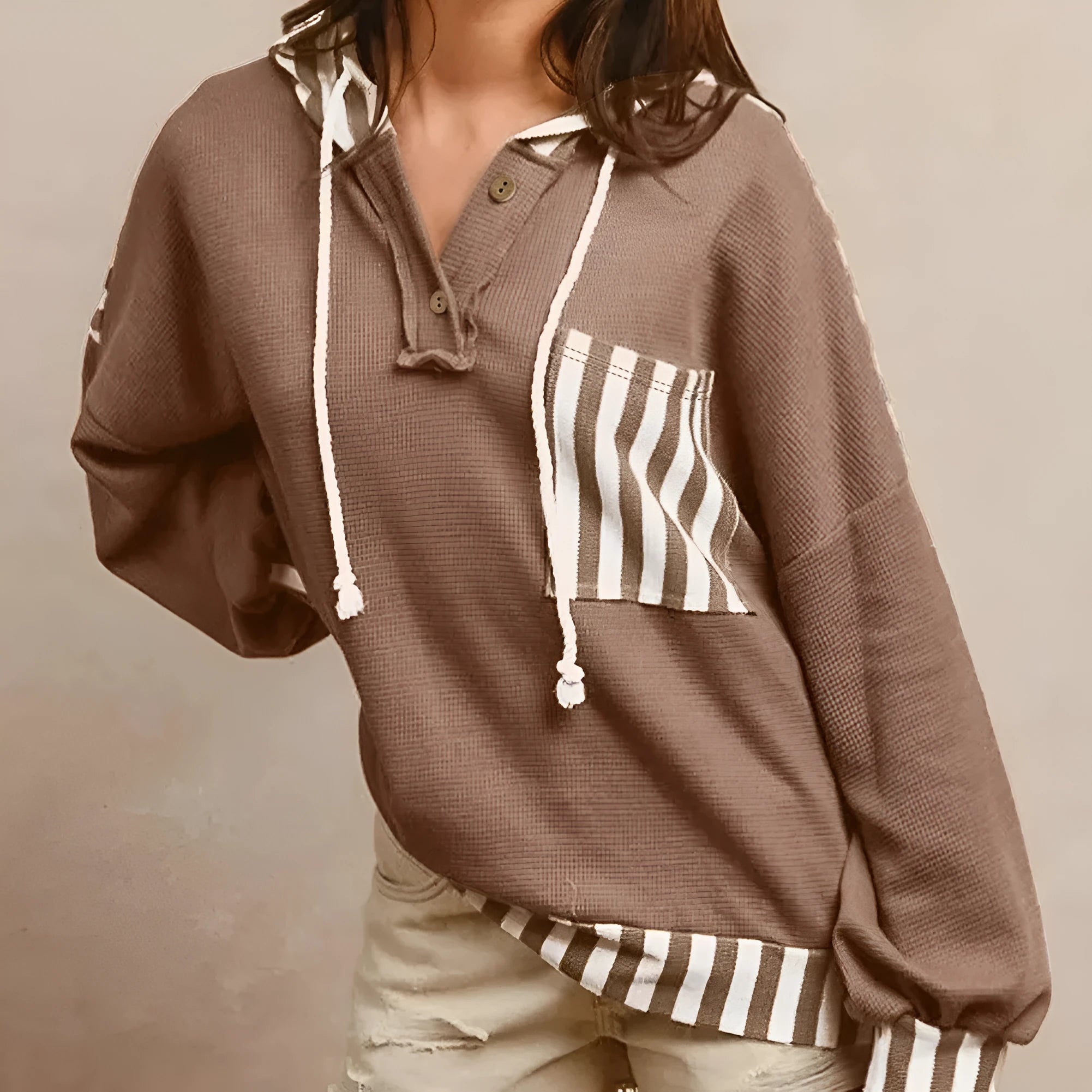 Straw yellow waffle texture hoodie with striped patchwork, button neck, and drawstring hood.