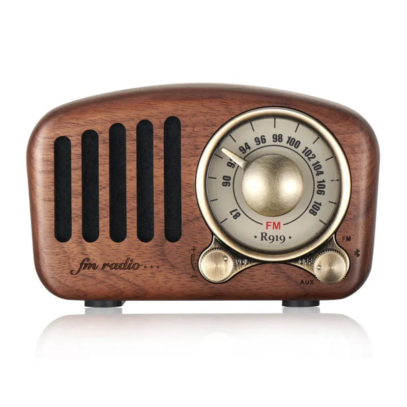 Retro wooden wireless mini speaker showing wood grain texture and compact size