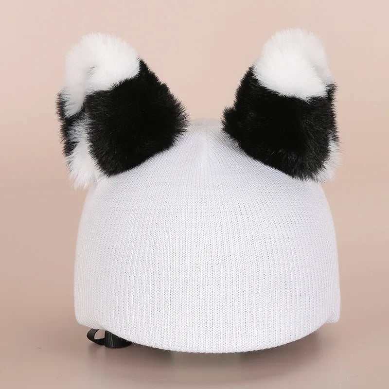 Plush fabric cartoon character decoration cover on a ski helmet