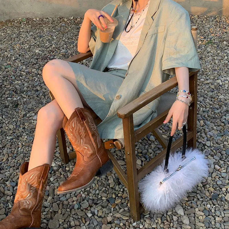 Brown embroidered women's mid-calf Martin boots with a waterproof platform and leather lining.