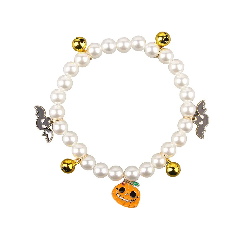 Purple Halloween cat collar with simulated pearl necklace and pumpkin ghost design for pets