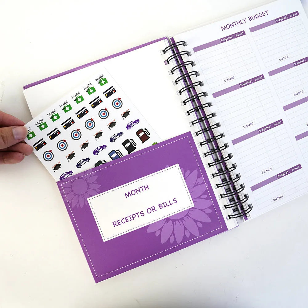 Purple coil-bound financial planning notebook with A4 dimensions for monthly budgeting