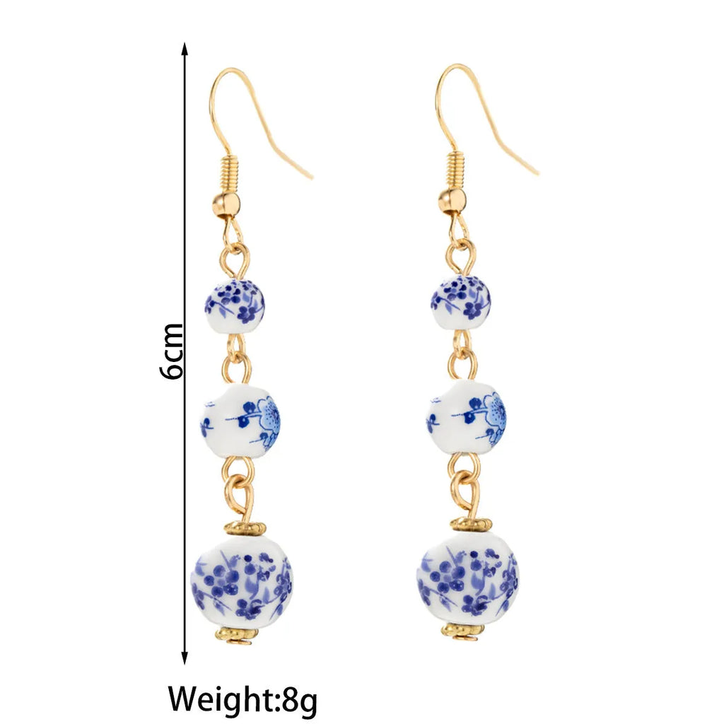 Long blue and white porcelain ceramic bead retro earrings with geometric Chinese style design on alloy.