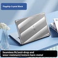 Clear plastic hard protective shell case for a MacBook Pro laptop on a table