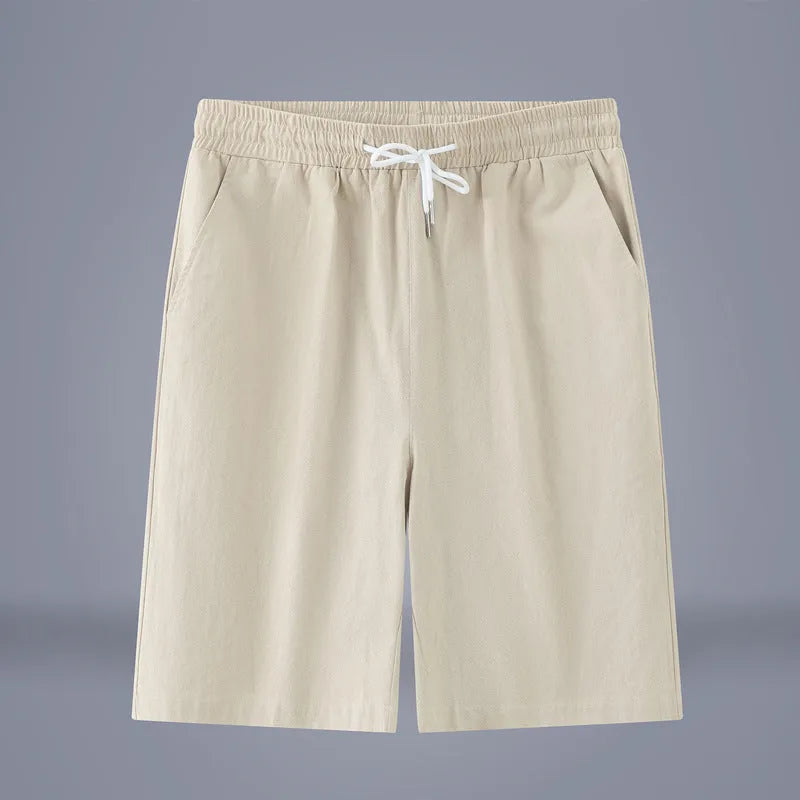 Solid colour cotton linen cropped pants with a drawstring waist on a hanger.