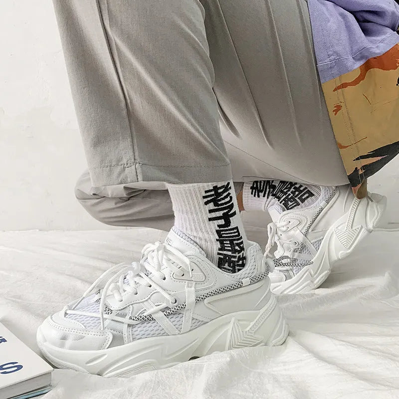 Men's Korean style platform dad sneakers in black, white, and grey colours with front lace-up closure