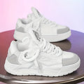 Men's white chunky low-top sneakers with round toe and lace-up front on rubber sole