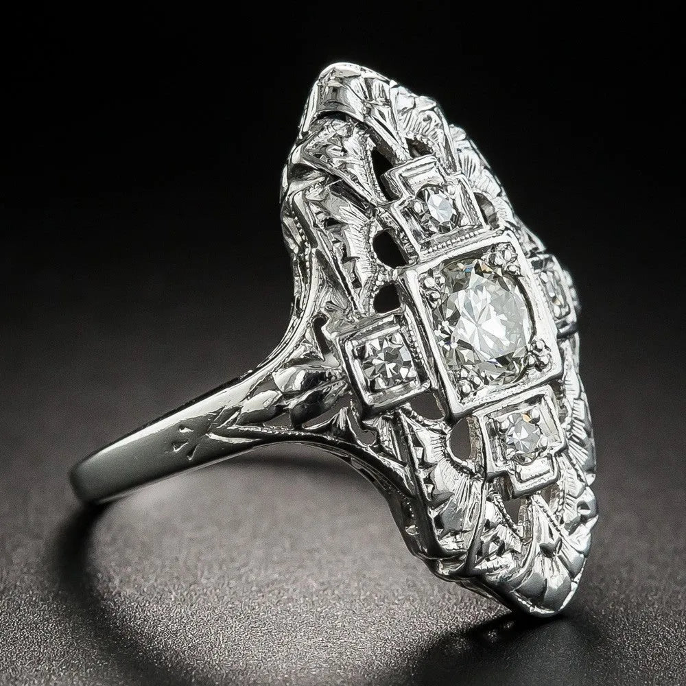Silver electroplated copper ring with hollow-out geometry pattern and diamond studded detailing