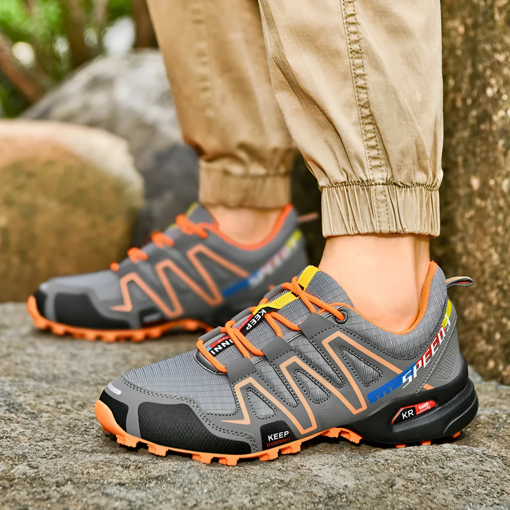 Men's gray orange plus size casual shoes with low-top design and rubber sole.