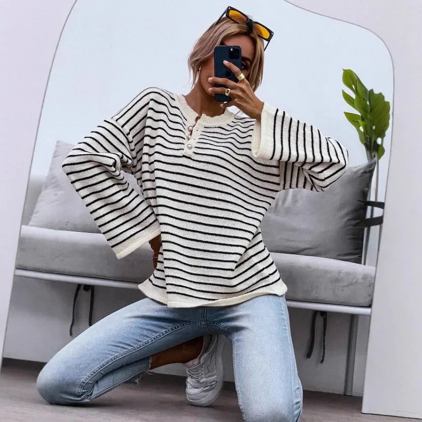 Women's black striped loose top with drop-shoulder sleeves and button details