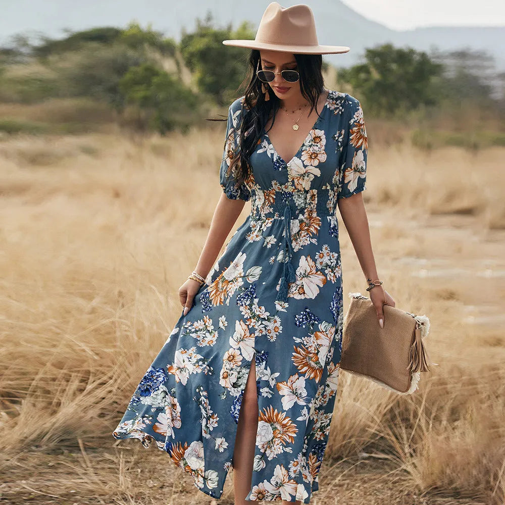 Women's floral print beach dress with V-neck, short sleeves, elastic waist, and mid-length skirt.
