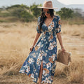 Women's floral print beach dress with V-neck, short sleeves, elastic waist, and mid-length skirt.