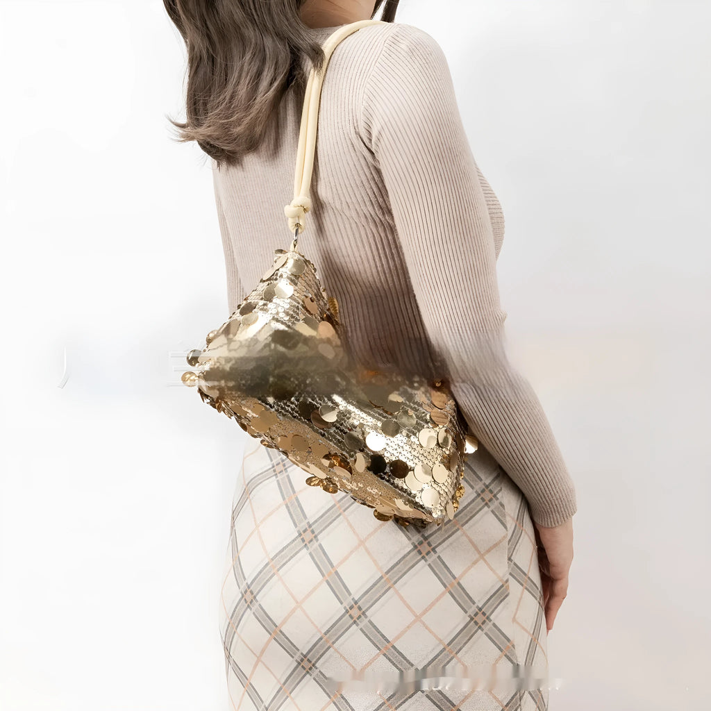 Women's crossbody bag in gold colour showing sandwich pocket design and single shoulder strap