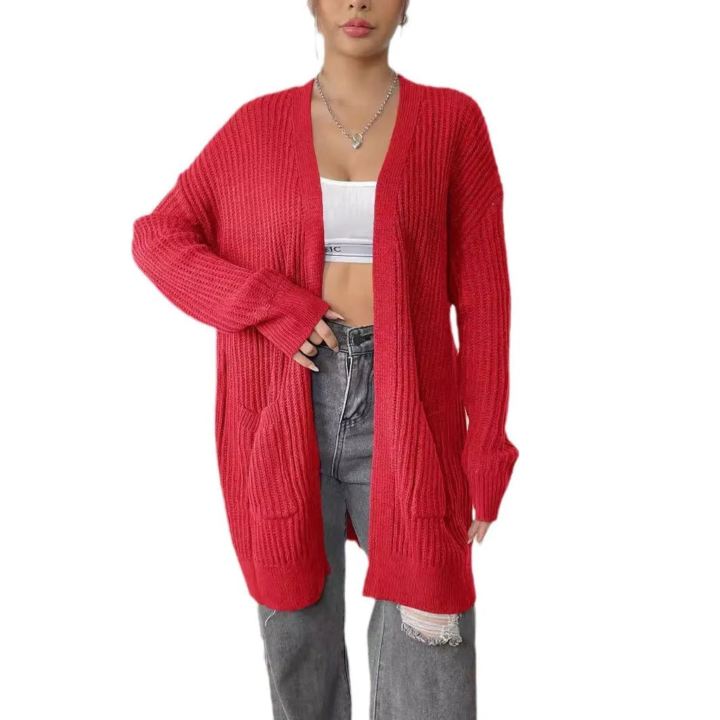 Women's dark green loose-fit cardigan with two front pockets and long sleeves
