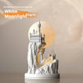White composite gypsum table lamp with cable and switch on a surface.