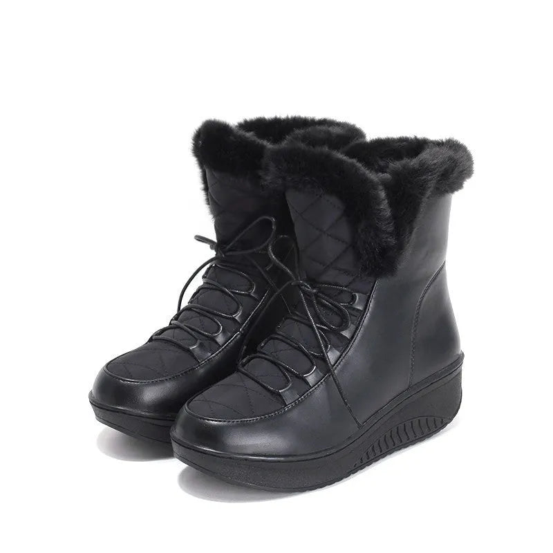 Black women's lace-up winter boots with a platform sole on a white background