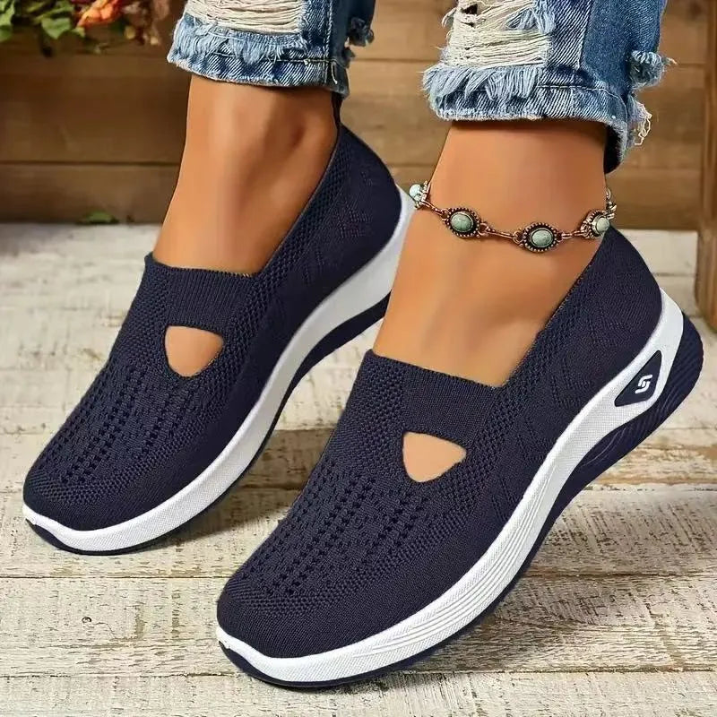 Women's low-top mesh casual shoes with a T-strap, flat heel, and round toe in various colours.