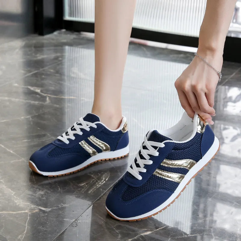 Blue women's casual sports shoes with cross shoulder straps and a round toe.