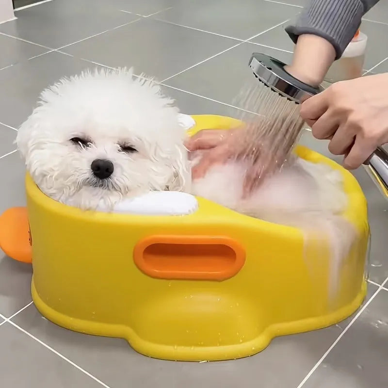 Blue duck-shaped PVC bathtub for washing dogs and cats on a flat surface.