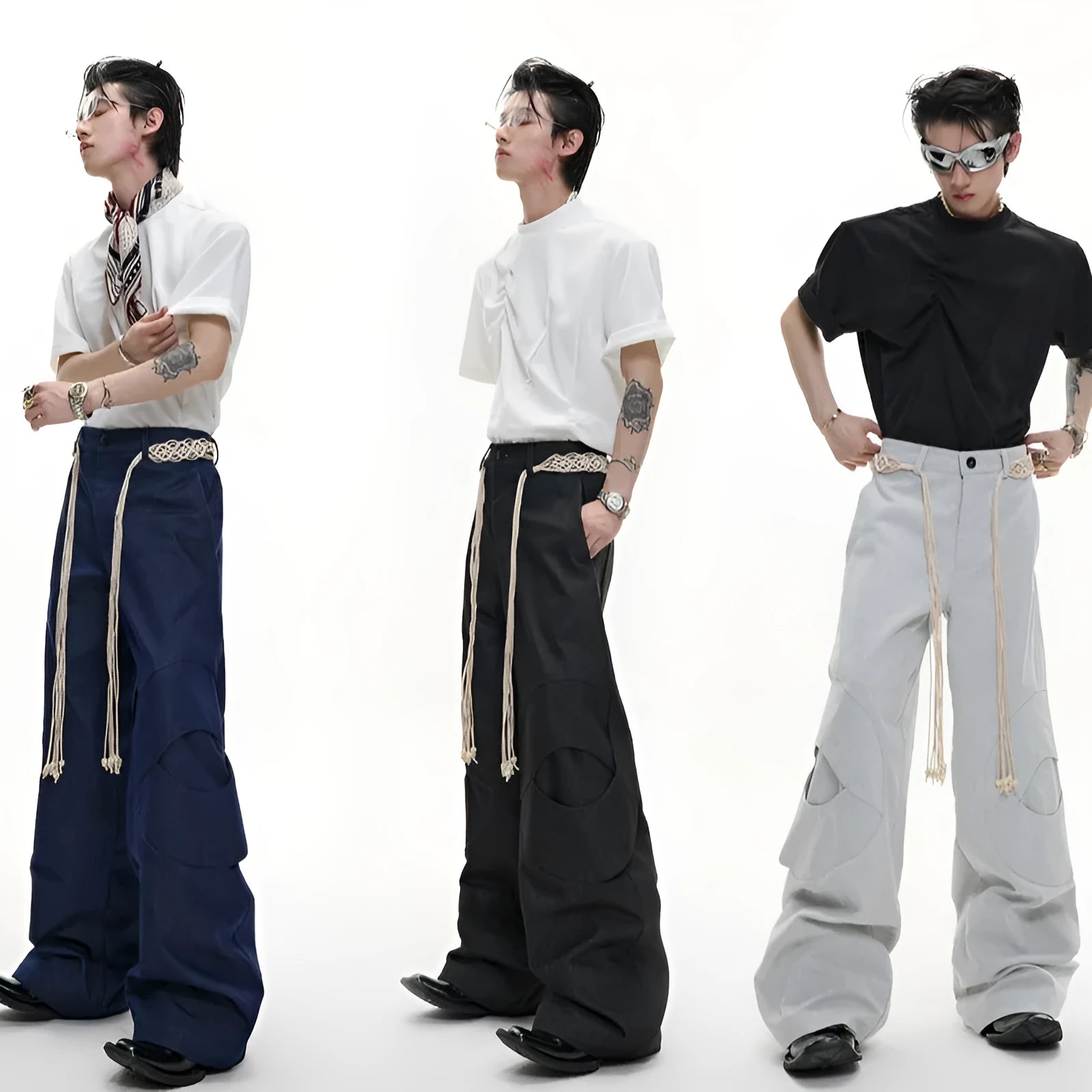 Men's dark blue cotton straight-leg jeans with loose fit, showing heavy 3D cutting, belt stitching, and decorative zip details.