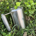 Silver stainless steel dumbbell cup with 8kg cast iron weight for strength training.