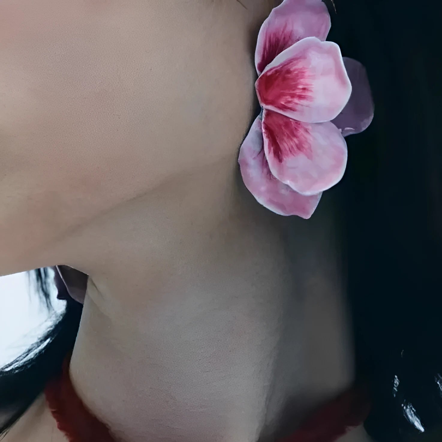 A pair of pastoral style flower stud earrings with an oil-spot glaze finish in an alloy setting.