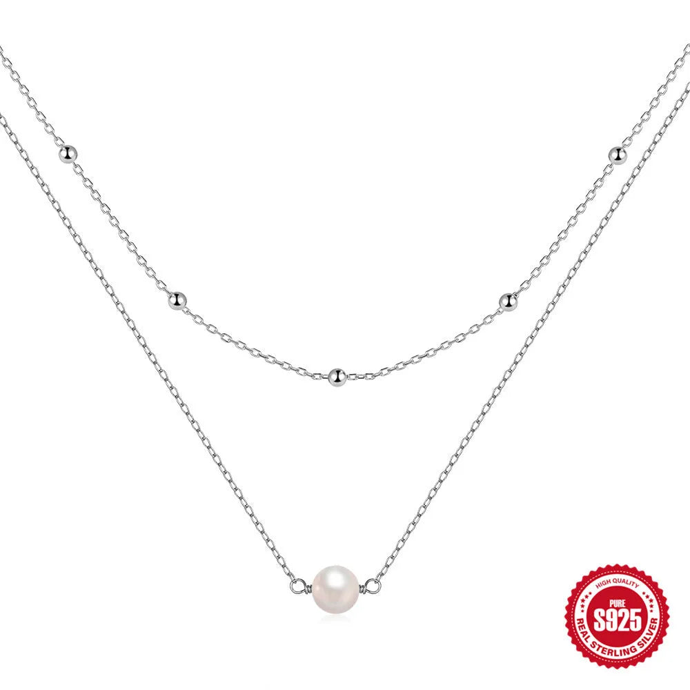 S925 sterling silver double layer necklace with twin pearls on a ball bead chain in gold colour.