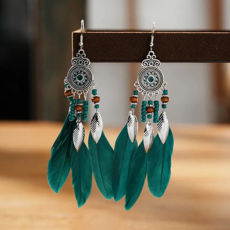 Round drop feather earrings with leaf design in alloy, showing electroplated finish in one of thirteen available colours.