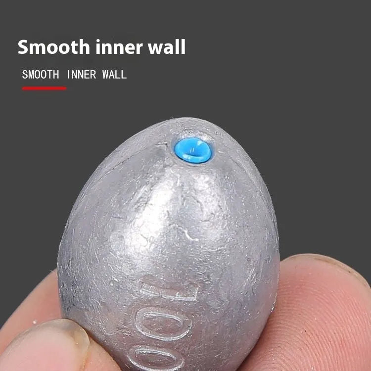 Tongxin scale pattern olive lead fishing sinker with plastic core, shown in rugby shape.