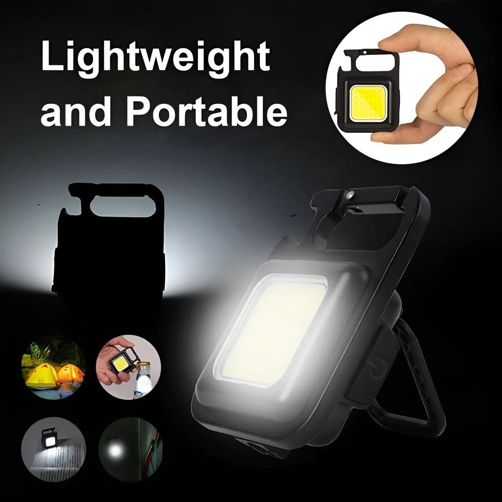 Black aluminium alloy USB rechargeable keychain torch with magnetic base and foldable handle.