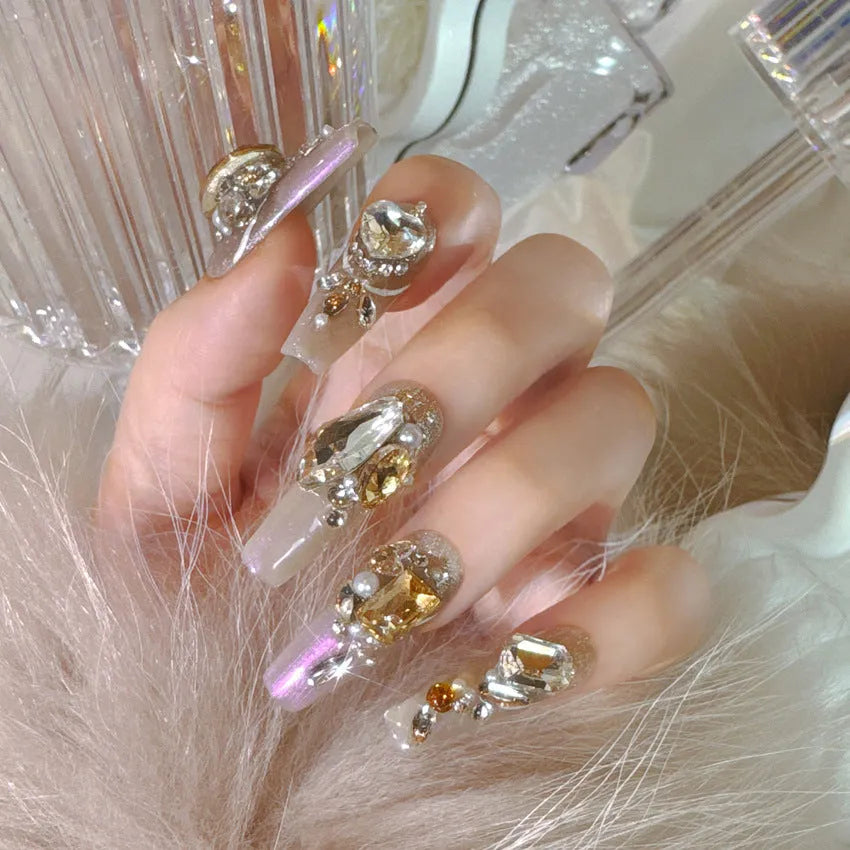 Rhinestone decorated false nail patches on a card, with jelly adhesive or tool set options.
