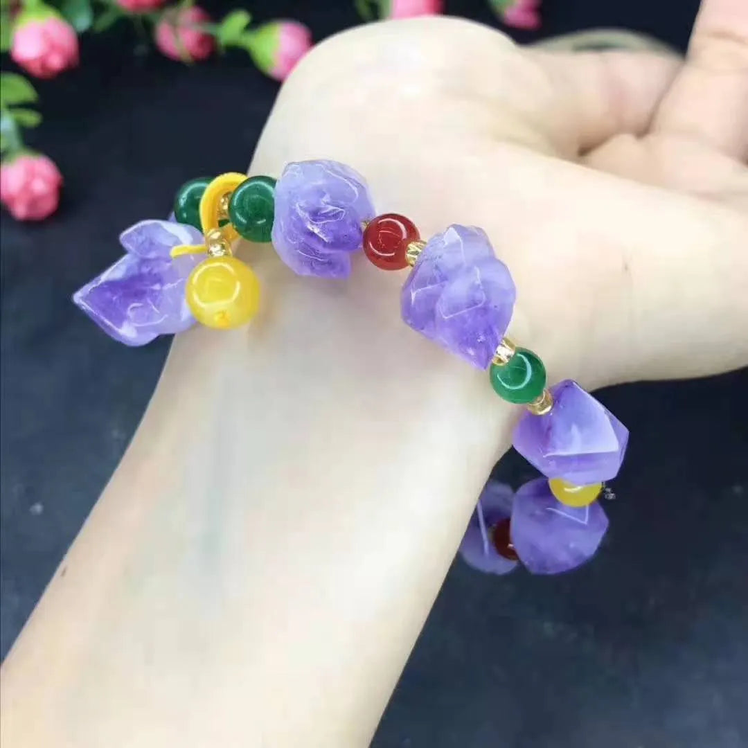 Natural purple amethyst bead bracelet for women with a fu character charm on a white background.