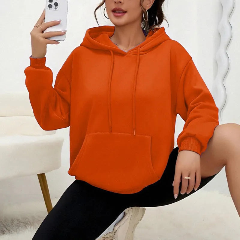 Women's loose grey drawstring hood sweatshirt with front pocket, long sleeves