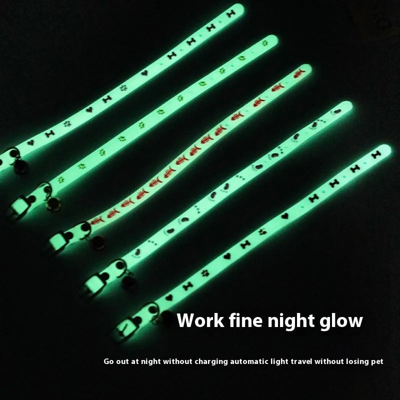 Luminous adjustable cat collar with a metal bell in a paw print pattern on a silicone rope.