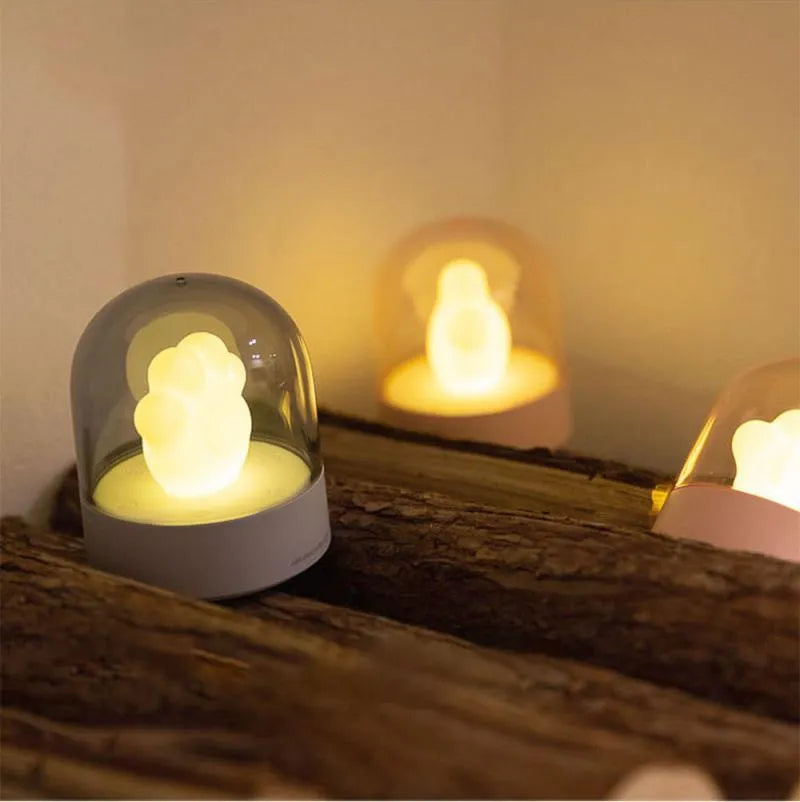 Grey or pink cat paw shaped USB rechargeable night light with music box and adjustable brightness levels