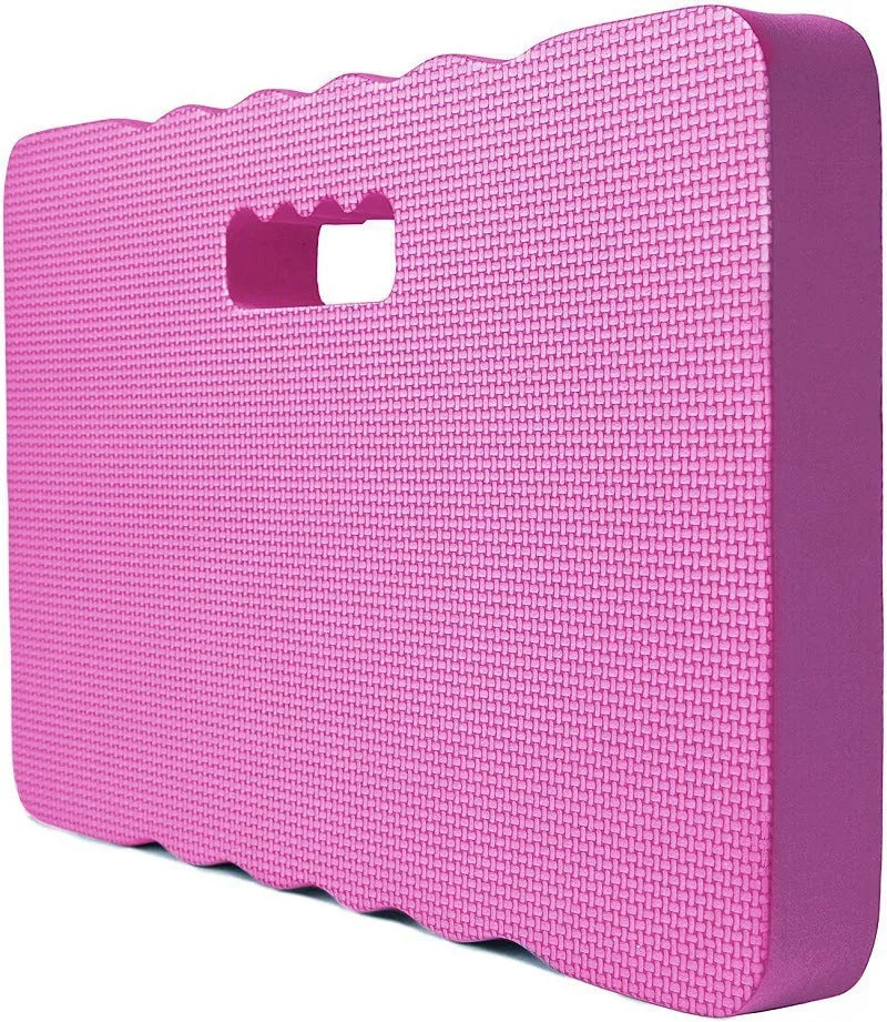 Blue EVA foam garden kneeler pad on grass, showing its rectangular shape and thickness for knee protection.