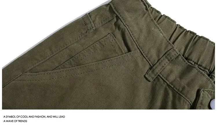 Casual apricot wide-leg cropped shorts with rivet details on a mid elastic waist
