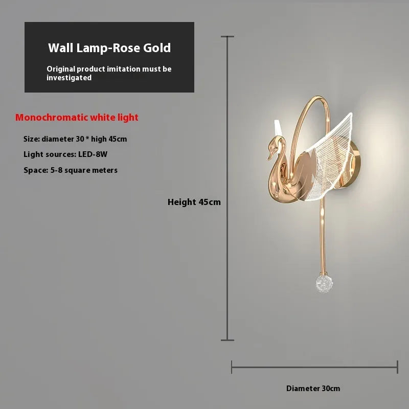 Gold minimalist swan-shaped wall lamp with acrylic shade and dimmable LED light.
