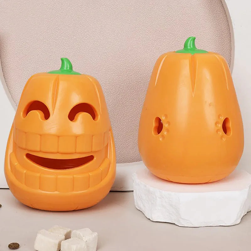 Orange Halloween pumpkin shaped dog chew toy with treat dispensing funnel opening
