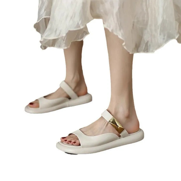 Women's apricot peep toe flat platform sandals with a leather upper and rubber sole.