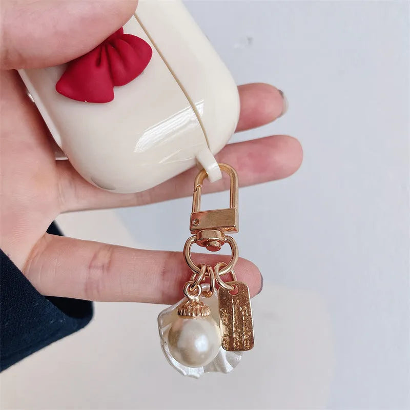Beige red bow shell TPU AirPods case with clamshell design for AirPods Pro