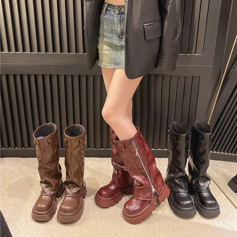 Women's platform muffin pants Martin boots in black with a high ankle top and square rubber heel.