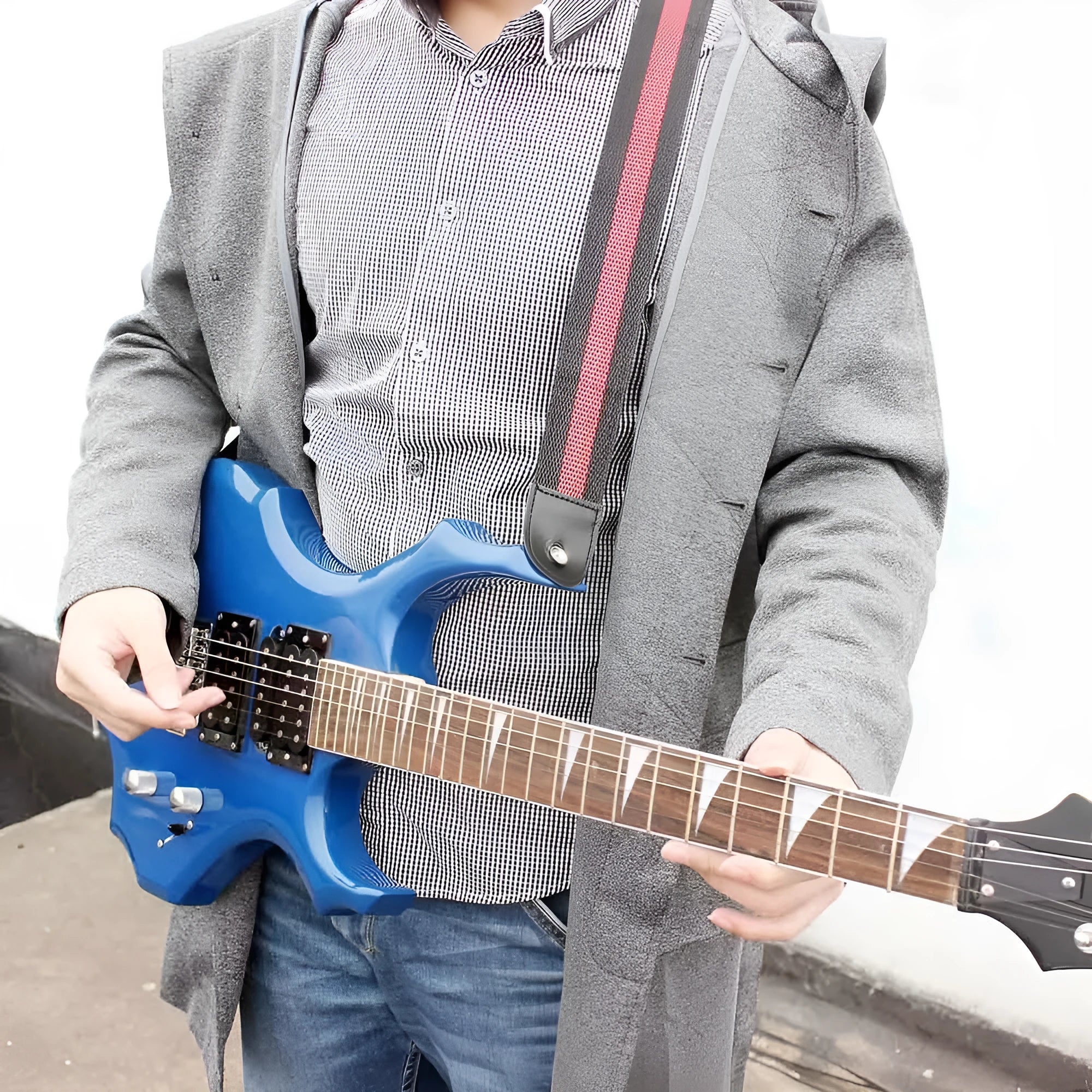 Universal woven guitar, bass, and ukulele strap shown in one of five colour options.