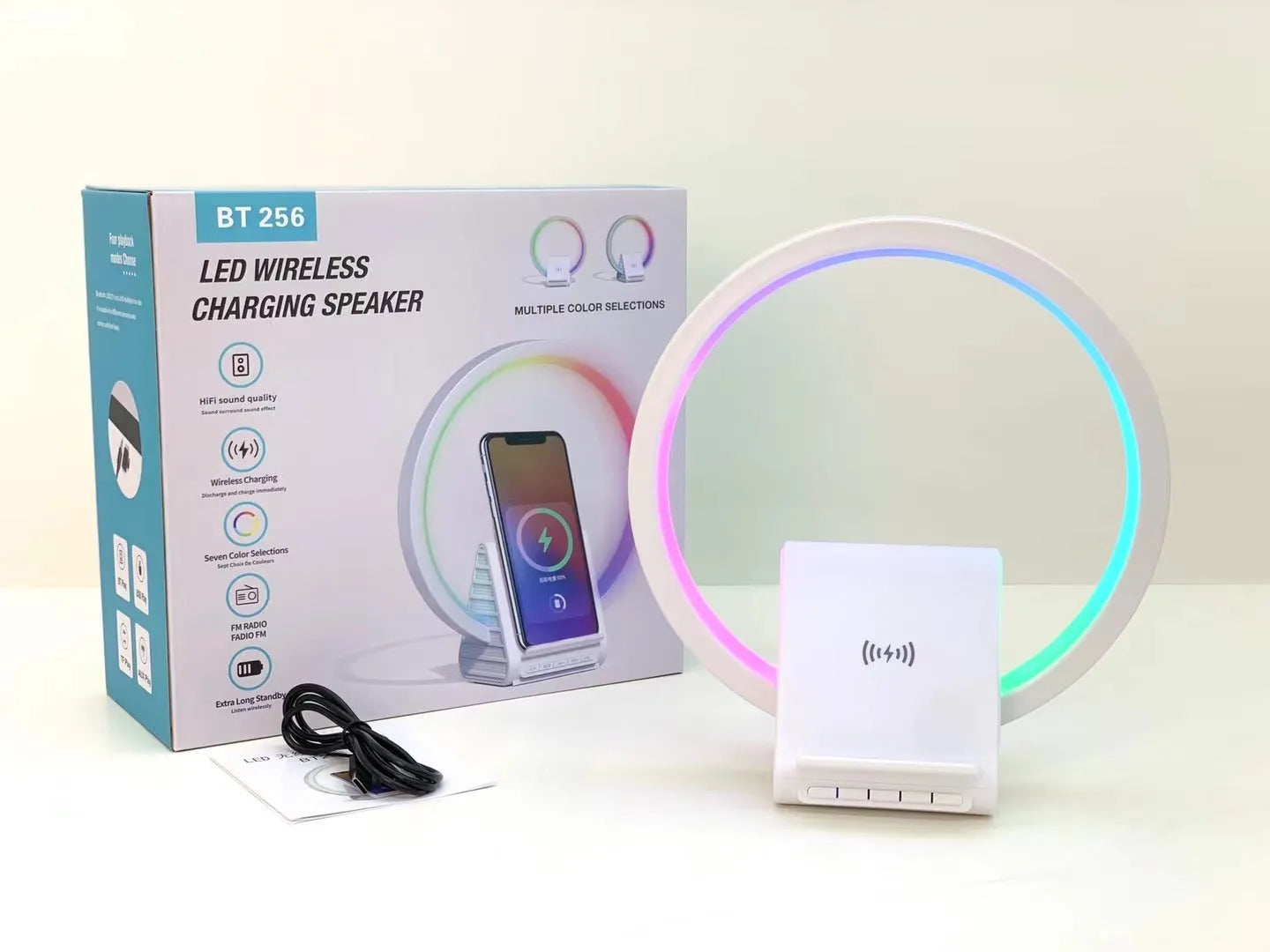 White Bluetooth speaker with wireless charging surface and ambient lighting, dimensions 225mm by 200mm