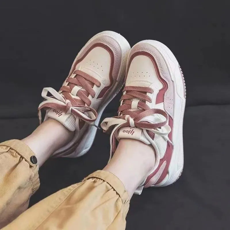 Pink and milky white low-top rubber sole sneakers with height increasing function