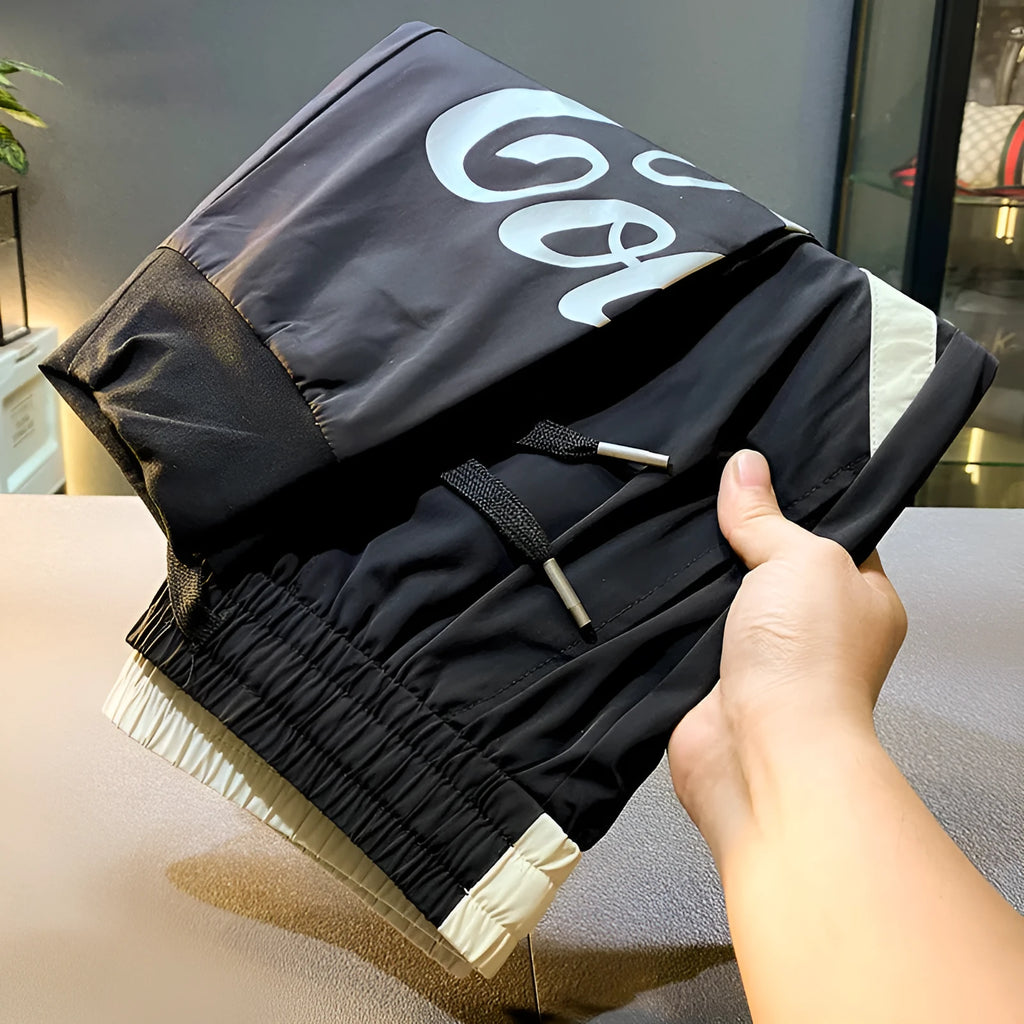 Black men's cropped casual trousers with ankle banding made from ultra-thin ice silk cotton fabric.